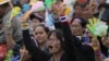 Anti-government protesters shout on the stage during a rally against a political amnesty bill at the democracy monument in Bangkok, Thailand, Nov. 8, 2013.