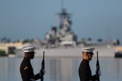 U.S. Marines stand in front of the USS Missouri during a ceremony to mark the 78th anniversary of the Japanese attack on Pearl Harbor, Dec. 7, 2019, at Pearl Harbor, Hawaii.