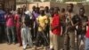 Members of a civilian defense group in Makary, Cameroon, arm themselves with bows and arrows. Authorities say such groups get support from soldiers in Cameroon’s Rapid Intervention Brigade. (M.E. Kindzeka/VOA)