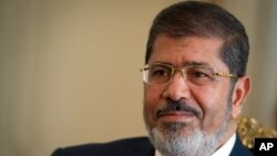 在开罗郊区埃及总统官邸的穆尔西