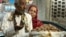 A man argues with his wife as they buy dried dates to break their fast at the date market in Cairo, Egypt, during the holy month of Ramadan, June 2, 2017.