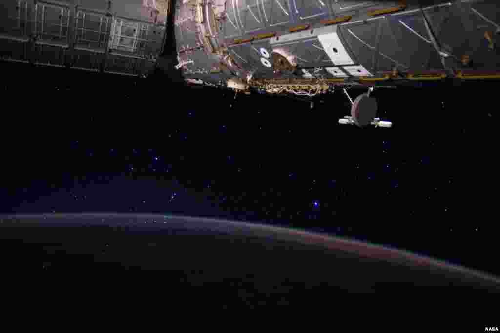 This image captured by Expedition 40 Flight Engineer Reid Wiseman from the&nbsp;International Space Station shows Earth and the stars. Among the &quot;stellar&quot; scene is part of the constellation Orion, near the center of the frame.