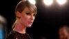 FILE - Taylor Swift arrives at the 2015 MTV Video Music Awards in Los Angeles, California, Aug. 30, 2015. 