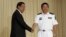 Yu Manjiang (R), commander officer of the Chinese fleet, is welcome by Cambodia's Prime Minister Hun Sen in Phnom Penh, Feb. 24, 2016. 