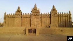 The world's largest mud-brick building, the Great Mosque of Djenne, Mali, awaits its annual replastering, Friday, May 10, 2024. (AP Photo/Moustapha Diallo, File)