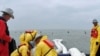 Crews put out booms in an effort to contain the spill in the Gulf of Mexico.