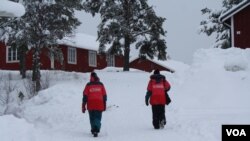 Aid workers from Hej Främling, an organization that seeks to improve the health of refugees and help them integrate into society, prepare to discuss how to repair trust in Grytan Camp, Sweden, after 15 sexual assaults in the past month, March, 21, 2016. 