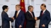 Mayor of Beijing Wang Anshun (L) and President of Chinese OC Committee Liu Peng (R) congratulated by IOC's President Thomas Bach (2nd L) and IOC's Vice President Ng Ser Miang after a signing ceremony in Kuala Lumpur, July 31, 2015. 