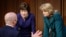 Homeland Security Secretary Alejandro Mayorkas, left, talks with Sen. Susan Collins, R-Maine, center, and Sen. Lisa Murkowski, R-Alaska, right, during a break of the Senate Appropriations committee hearing to examine domestic extremism, May 12, 2021.