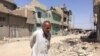 Abd Elaam is one of the only people living in the Old Mosul in Iraq, where the destruction has been compared to World War II Dresden, Aug. 27, 2017. 