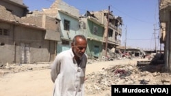 Abd Elaam is one of the only people living in the Old Mosul in Iraq, where the destruction has been compared to World War II Dresden, Aug. 27, 2017. 