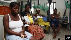 Pregnant women watch television as they wait in the pre-natal ward at Princess Christian Maternity Hospital in Freetown, Sierra Leone, September 10, 2010.