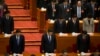 China's top leaders including Chinese President Xi Jinping, bottom center and Chinese Premier Li Keqiang, bottom right, have a moment of silence to commemorate the victims of a slashing spree during the opening session of the Chinese People's Political Consultative Conference in Beijing's Great Hall of the People, China, March 3, 2014.