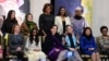 First Lady Michelle Obama, back row, center, poses with recipients of the Secretary of State’s International Women of Courage Award, Washington, March 4, 2014.