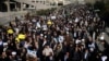 Iranian worshipers chant slogans during a rally against anti-government protesters after Friday prayers in Tehran, Iran, Jan. 5, 2018. 