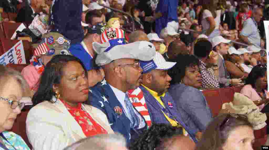 Delegates sport their hats at the DNC in Philadelphia (Photo: S. Barua/VOA)
