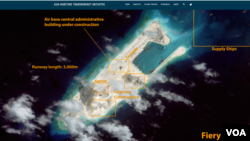 卫星图片显示，南中国海争议岛屿永暑礁上的飞机跑道建设接近完成（图片来源：CSIS网页截屏）
