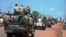 Central African troops in charge of disarmament drive a tank through Bangui, Central African Republic, Sept. 5, 2013.