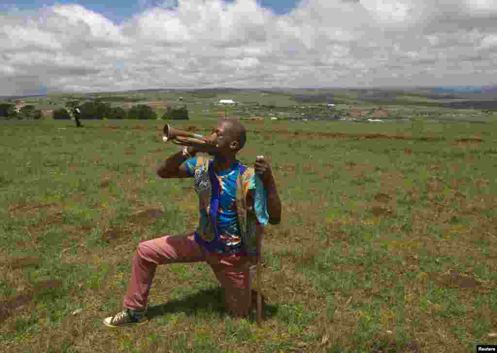 A Zulu man plays a bugle after the funeral of Nelson Mandela in Qunu, Dec. 15, 2013.&nbsp;