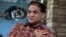 FILE - Ilham Tohti, an outspoken scholar of China's Turkic Uighur ethnic minority, speaks during an interview at his home in Beijing, China, Feb. 4, 2013.