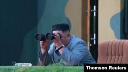North Korean leader Kim Jong Un watches the test-fire of two short-range ballistic missiles Thursday, in this undated picture released by North Korea's Central News Agency, July 26, 2019. 