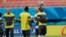 FILE - Cameroon's Pierre Webo, right, controls a ball during an official training session at the Arena da Amazonia in Manaus, Brazil, June 17, 2014. Many African youngsters dreaming of becoming wealthy football stars abroad face an uphill battle, a new report finds.