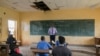 FILE - A teacher wearing a face shield teaches a class at the Technical High School of Nkol-Bisson in Yaoundé, Cameroon, June 1, 2020. 