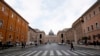 Tourists walk near St. Peter's square at the Vatican, March 3, 2020.