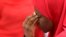 FILE - A woman takes part in a protest for the release of the abducted secondary school girls in the remote village of Chibok, during a sit-in protest at the Unity fountain Abuja, May 12, 2014.