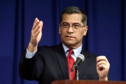 FILE - California Attorney General Xavier Becerra speaks during a news conference in Sacramento, California, March 5, 2019.