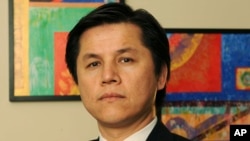 FILE - Nury Turkel, a leader in the Uighur-American community, is photographed in his office on Oct. 9, 2008, in Washington. (AP Photo/Kevin Wolf)