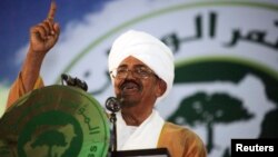 Sudanese President Omar Hassan al-Bashir addresses the general conference of the ruling National Congress Party in Khartoum, Oct. 23, 2014.