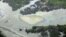 In this March 24, 2011 file photo, oil is seen on the creek's surface near an illegal oil refinery in Ogoniland, outside Port Harcourt, in Nigeria's Delta region (AP).