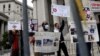 FILE - People protest against New York City-mandated vaccines against COVID-19, in front of the U.S. Courthouse in Manhattan, New York, Oct. 12, 2021.
