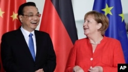 李克强2018年7月9日会见德国总理默克尔（美联社）