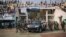 FILE - A vehicle carrying the president of the Central African Republic, Faustin-Archange Touadera, arrives at a stadium for an election rally, in Bangui, Dec. 19, 2020.