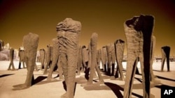Agora, a procession of 106 headless and armless cast-iron sculptures at the south end of Grant Park in Chicago, was designed by Polish artist Magdalena Abakanowicz.