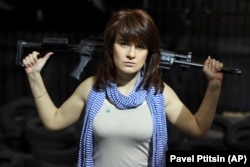 RUSSIA -- Maria Butina, a gun-rights activist, poses for a photo at a shooting range in Moscow, April 22, 2012