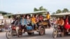 Cambodian garment workers share a tuk-tuk after work, Phnom Penh, Cambodia, May 25, 2017. (Khan Sokummono/VOA Khmer) 