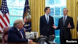 FILE - President Donald Trump listens as Brian Hook, former US envoy to Iran, speaks after it was announced Bahrain has joined the United Arab Emirates in striking an agreement to normalize relations with Israel in the Oval Office, Sept. 11, 2020.