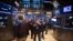 Traders work on the floor of the New York Stock Exchange in New York, March 18, 2014.