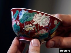 The ruby-ground falangcai "Double-Lotus" bowl is shown after being sold for HK$74 million ($9.5 million) at Sotheby's Spring Sales in Hong Kong, April 8, 2013.