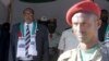 FILE - President Ahmed Mohamed Silanyo stands to salute troops during a street parade to celebrate independence day for the breakaway Somaliland nation from Somalia in the capital, Hargeysa, May 18, 2015. 