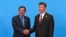 Cambodian Prime Minister Hun Sen, left, and Chinese President Xi Jinping, right, shake hands during the welcome ceremony for the Belt and Road Forum, at the International Conference Center at Yanqi Lake in Beijing, Monday, May 15, 2017. (Roman Pilipey/Pool Photo via AP)