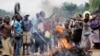 Demonstrators, protesting President Pierre Nkurunziza's decision to seek a third term, block a road in the village of Rwenza near Bujumbura, Burundi, May 5, 2015.