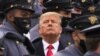 Surrounded by Army cadets, President Donald Trump watches the first half of the 121st Army-Navy Football Game in Michie Stadium at the United States Military Academy, Dec. 12, 2020, in West Point, N.Y.