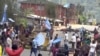 FILE - A still image taken from a video shot on Oct. 1, 2017, shows protesters waving Ambazonian flags in front of road block in the English-speaking city of Bamenda, Cameroon. 