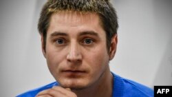 Openly gay Maxim Lapunov, 30, gives a press conference in Moscow on October 16, 2017. A gay man living in Chechnya on October 16, 2017 went public to describe his detention and torture by police during a crackdown on gay men in the region ruled by strongman Ramzan Kadyrov. / AFP PHOTO / Alexander NEMENOV