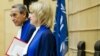 Presiding Judge Bruno Cotte from France (L) and Judge Christine Van Den Wyngaert from Belgium (R) stand during the verdict of the trial of Congolese warlord Mathieu Ngudjolo Chui at the International Criminal Court (ICC) in The Hague, December 18, 2012.