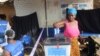 FILE - A woman votes in Liberia's Special Senatorial election.